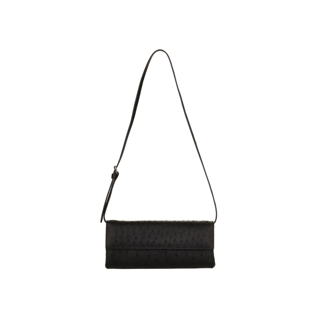 Black woven handbag with a strap on a white background