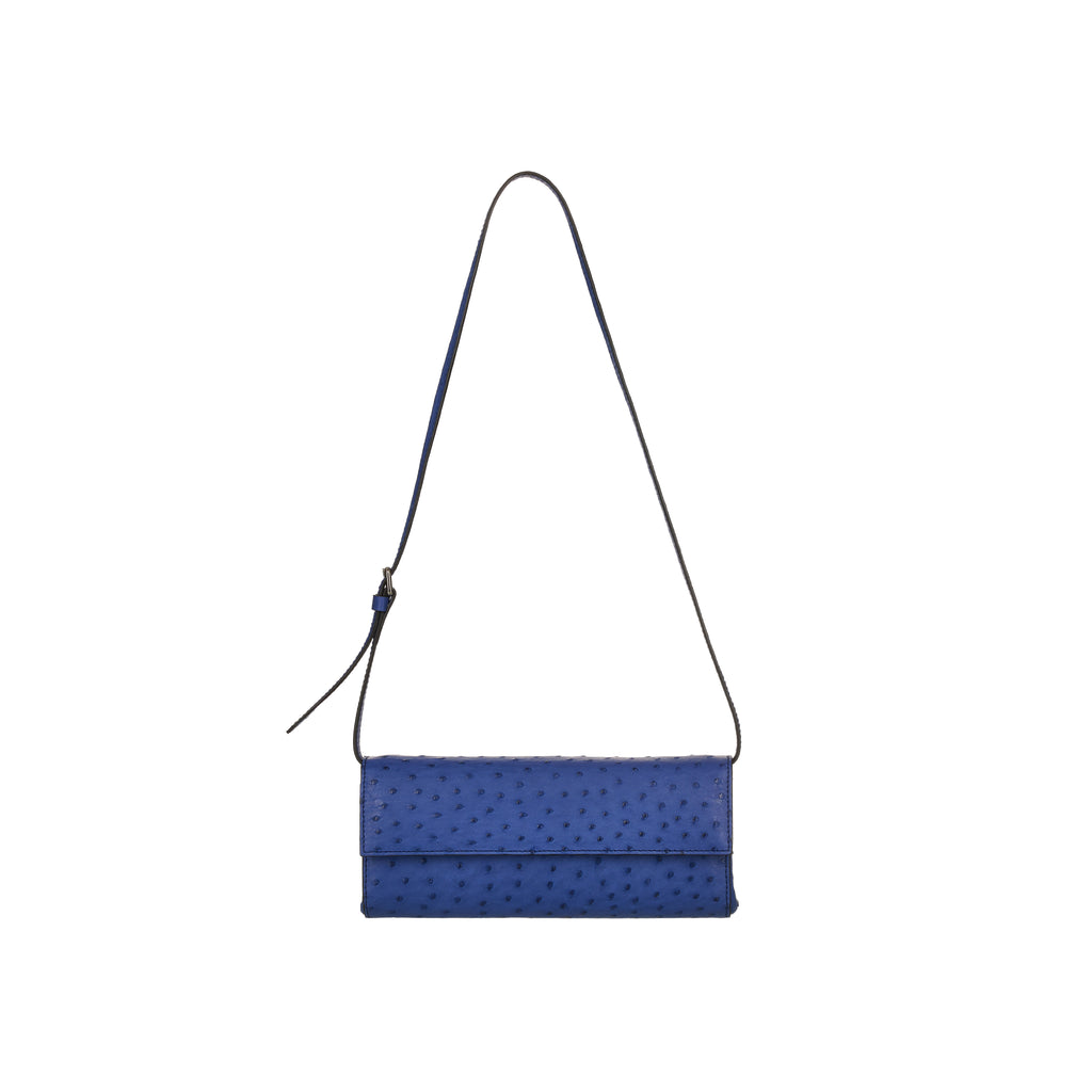 Blue clutch bag with a strap on a white background