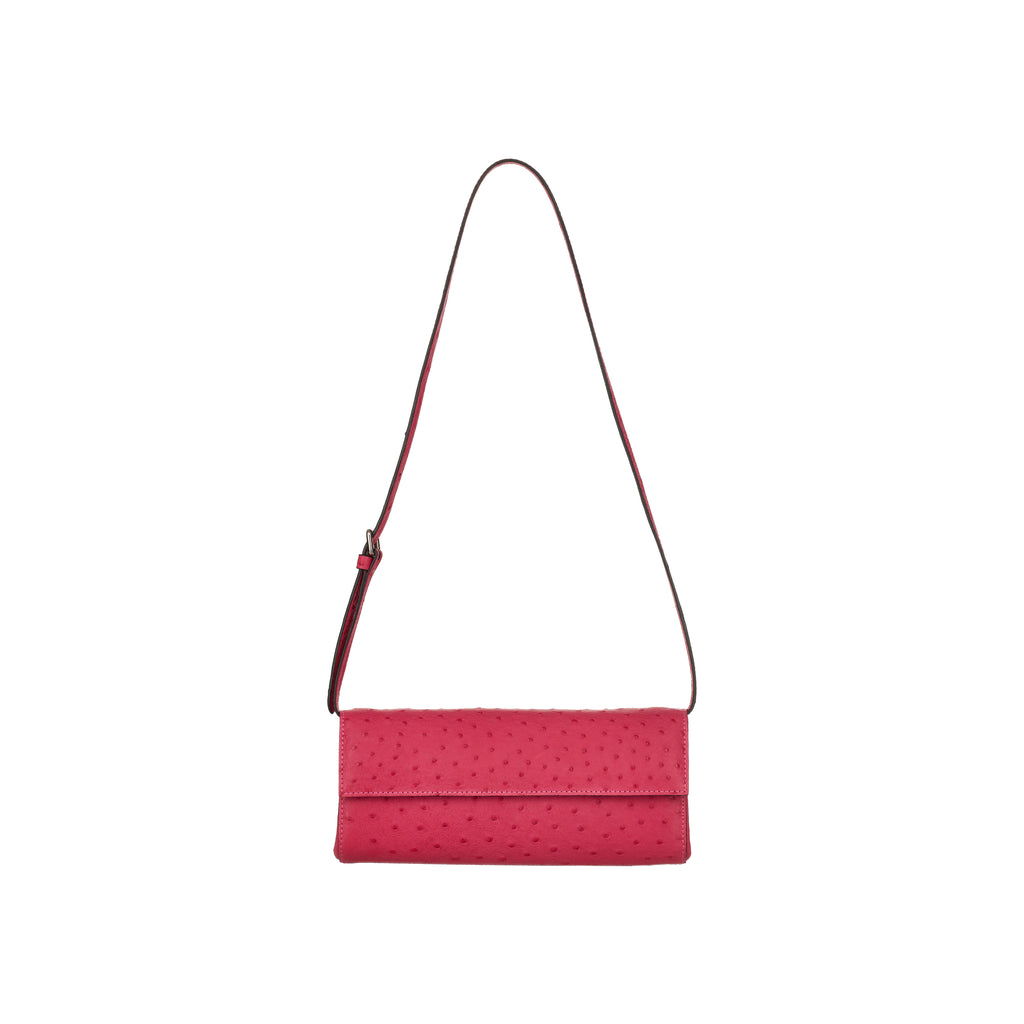 Pink handbag with a strap on a white background