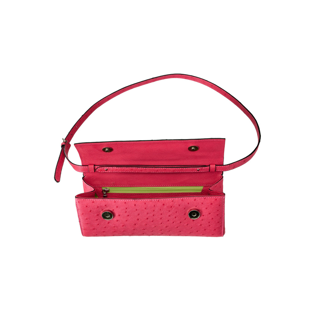 Pink handbag with a red strap on a white background