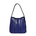 Blue handbag with a textured pattern on a white background