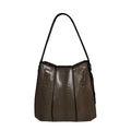 Brown textured handbag on a white background