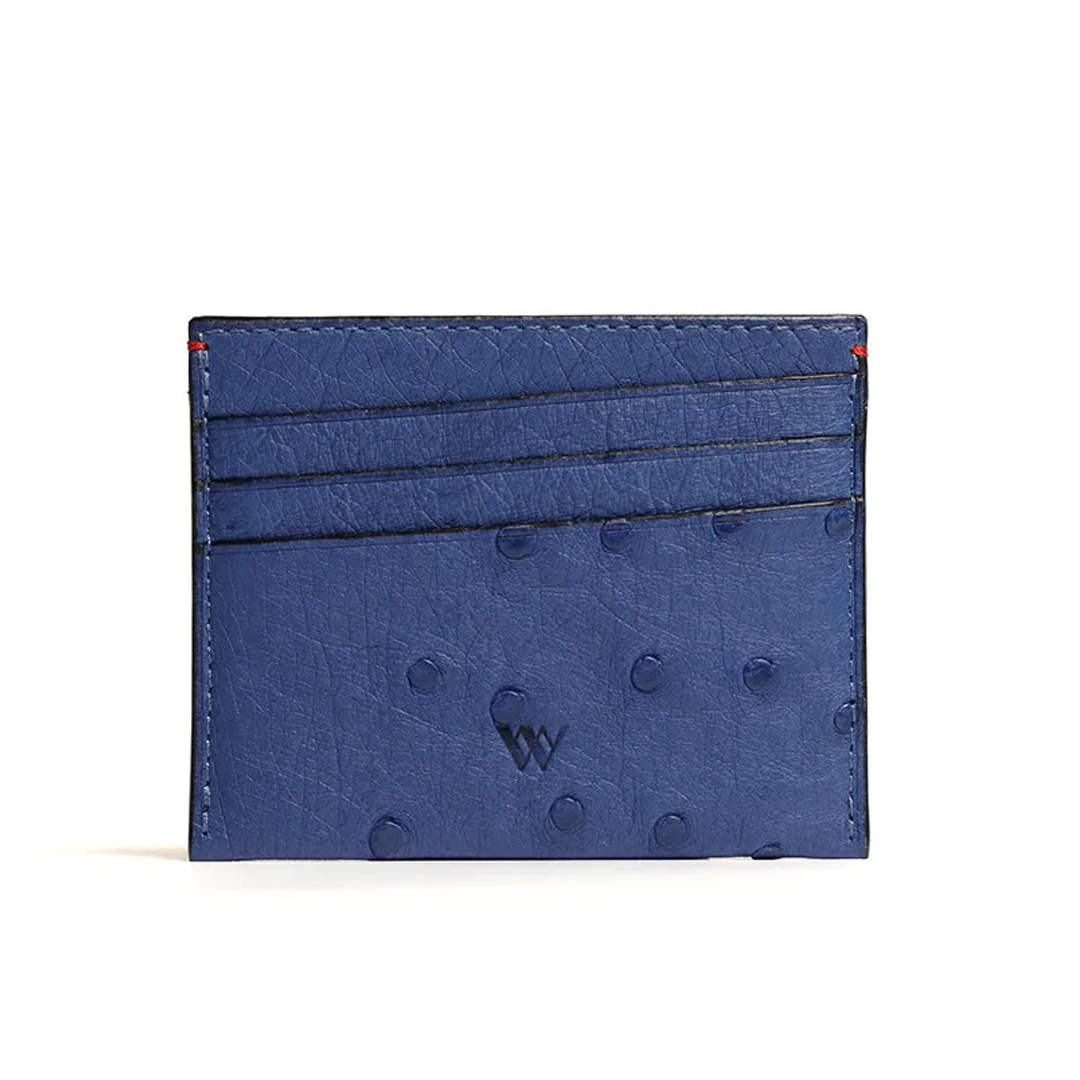 A blue card holder with multiple card slots and a small amount of cash, made from ostrich quill leather.