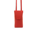A red leather small bag with a magnetic front closure and a long adjustable strap, displayed against a white background.