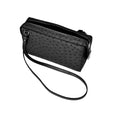 Black textured handbag with a strap on a white background