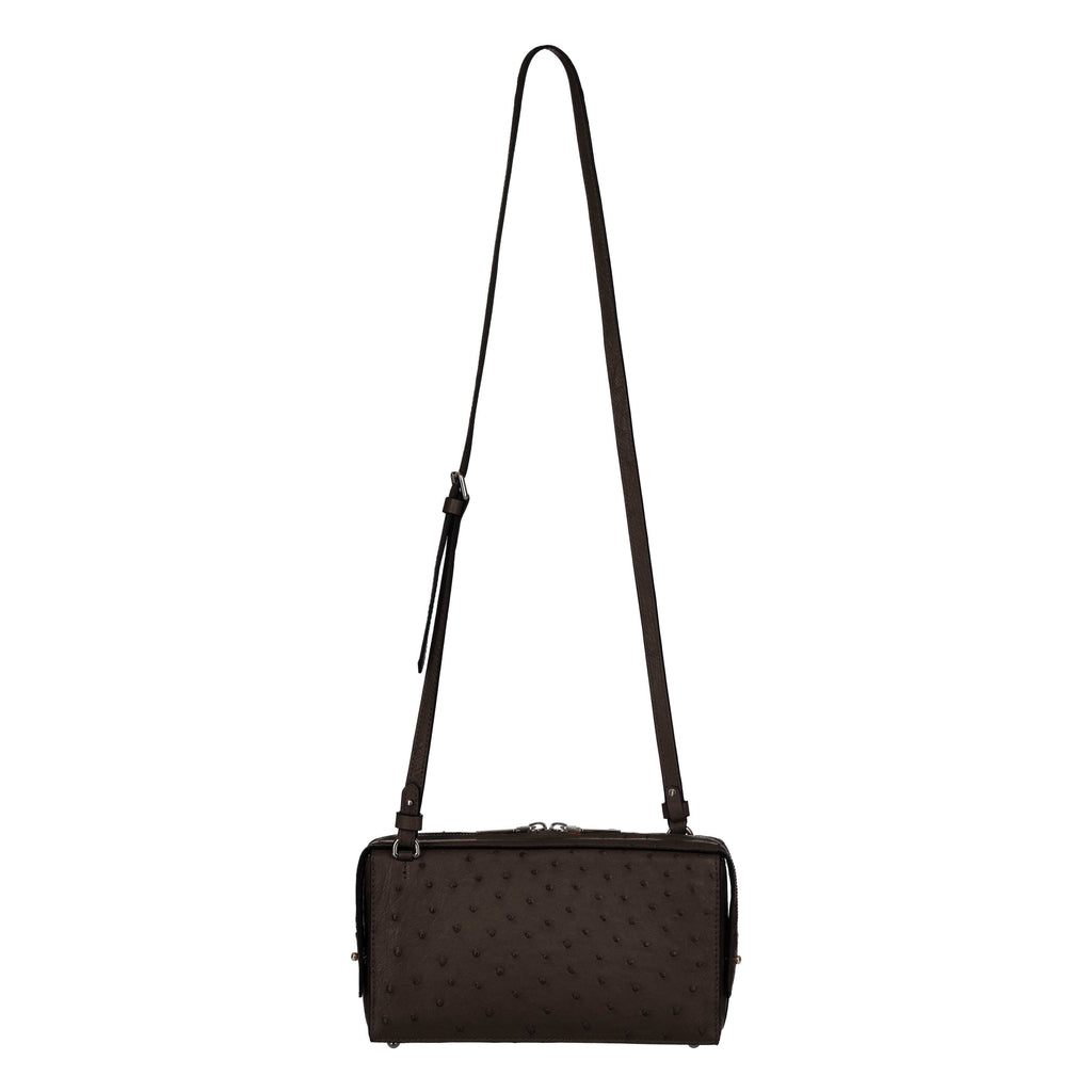 Black textured handbag with a strap on a white background