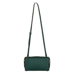 Green handbag with a strap on a white background