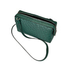 Green textured handbag with a strap on a white background