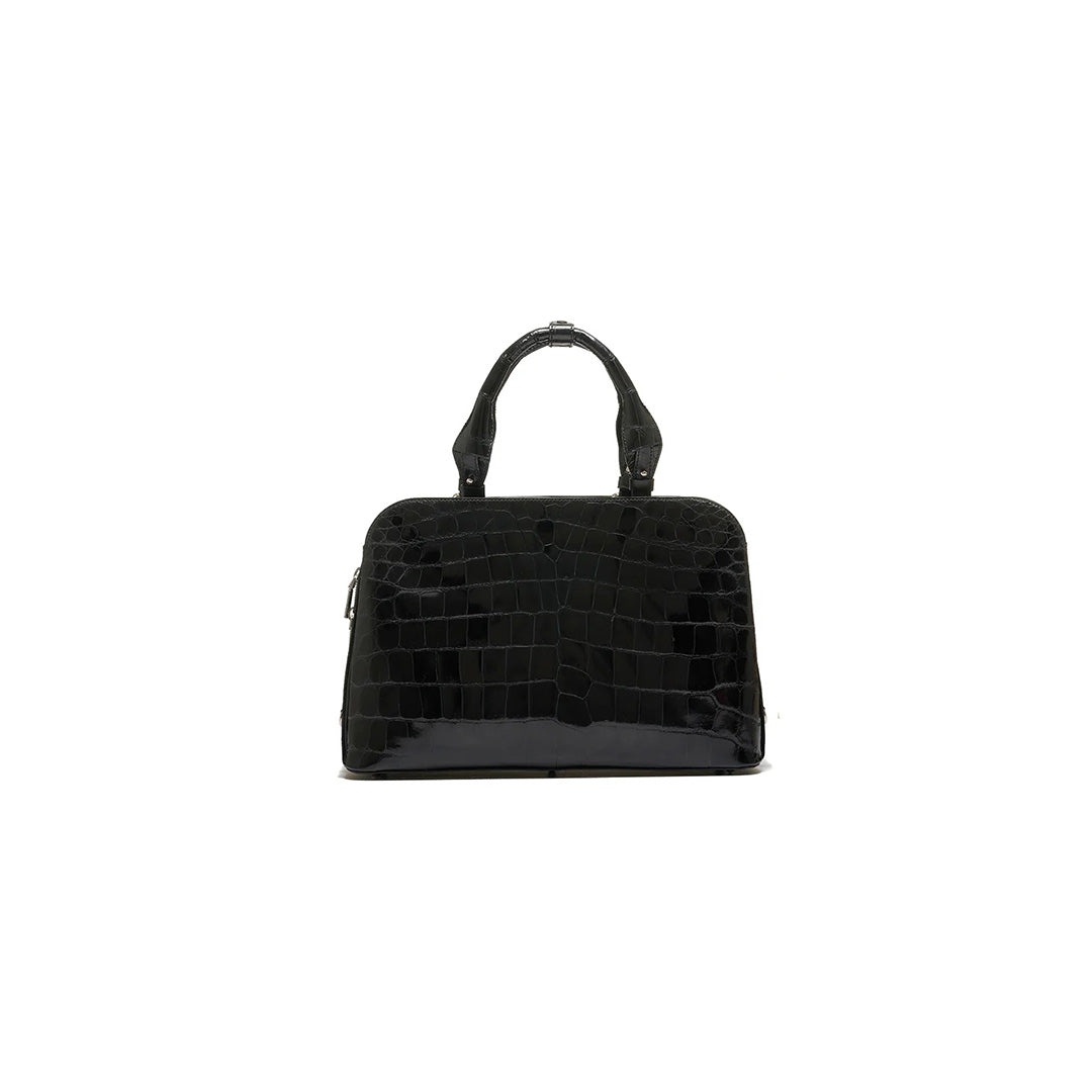 A black luxury handbag with a structured design, featuring two handles and a detachable strap.