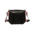 Black handbag with light pink gussets and a structured design, featuring a magnetic top closure and a removable link strap.