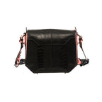 Black handbag with light pink gussets and a structured design, featuring a magnetic top closure and a removable link strap.