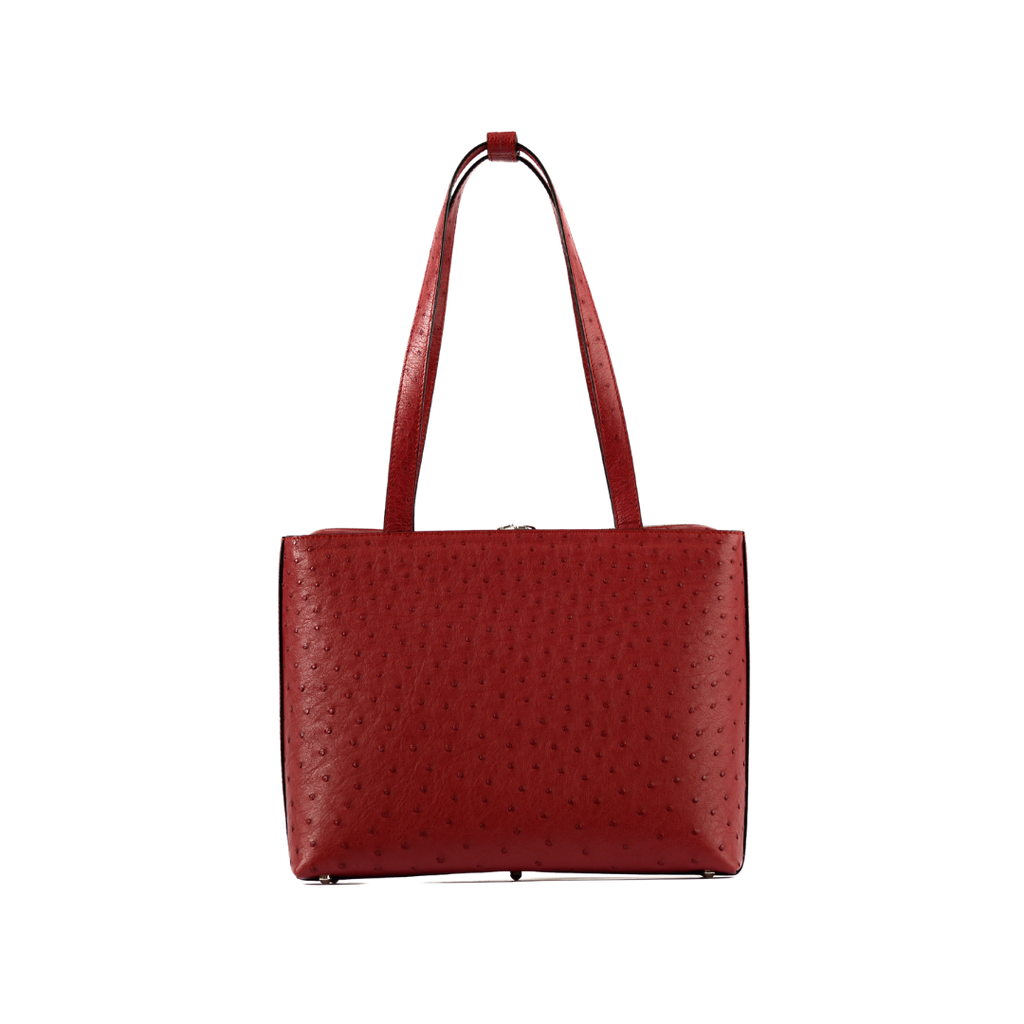 Red textured handbag on a white background
