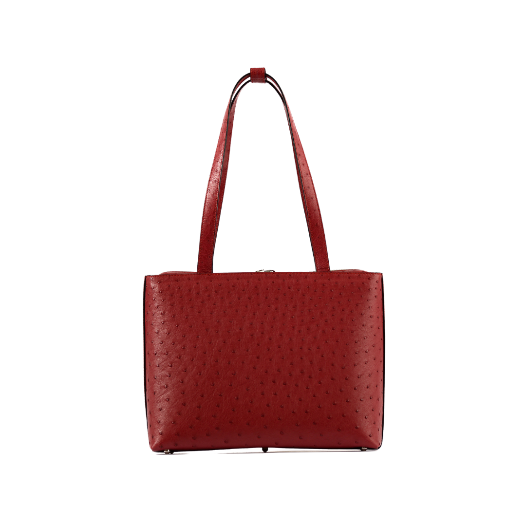 Red textured handbag on a white background