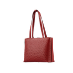 Red textured handbag on a white background