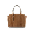 A brown leather handbag with a sleek design, featuring a structured handle and a textured surface.