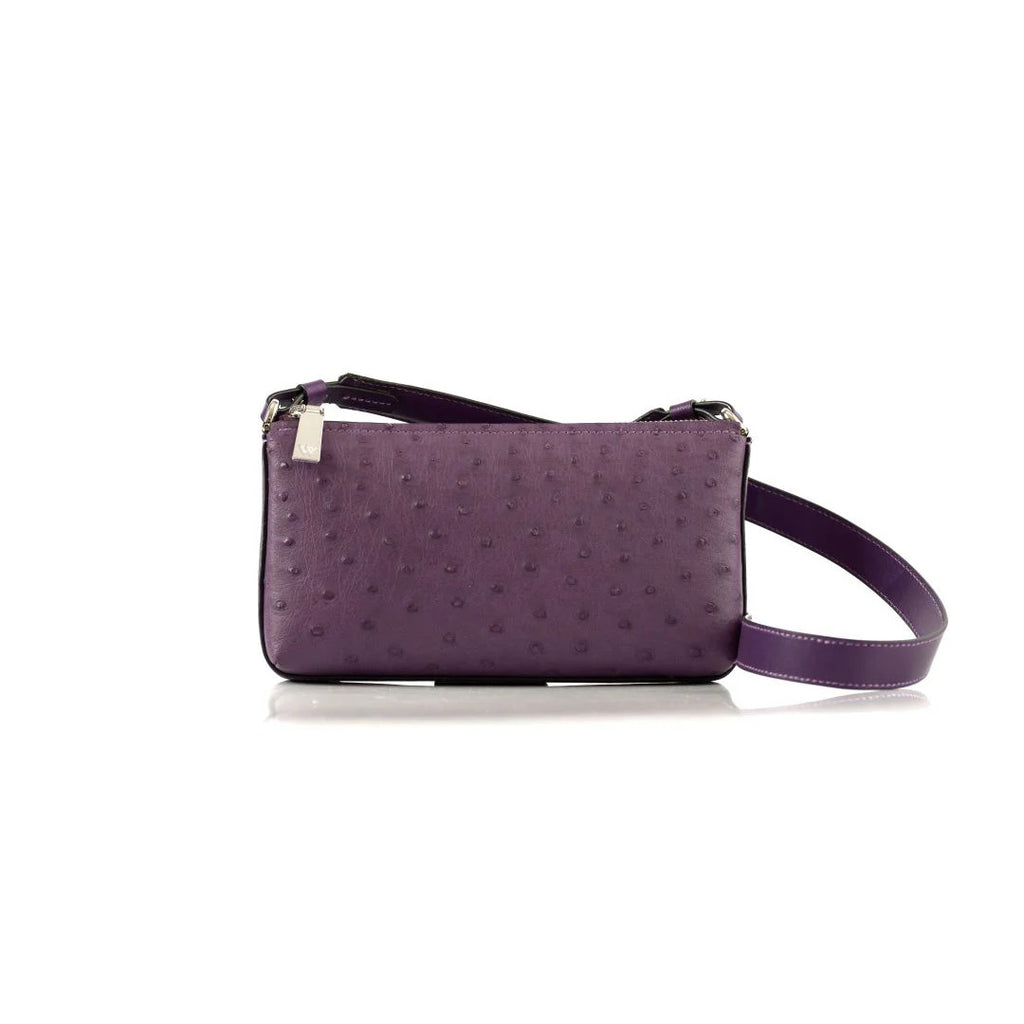 A compact, African violet colored leather handbag with a long strap, featuring a textured pattern.