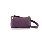A compact, African violet colored leather handbag with a long strap, featuring a textured pattern.