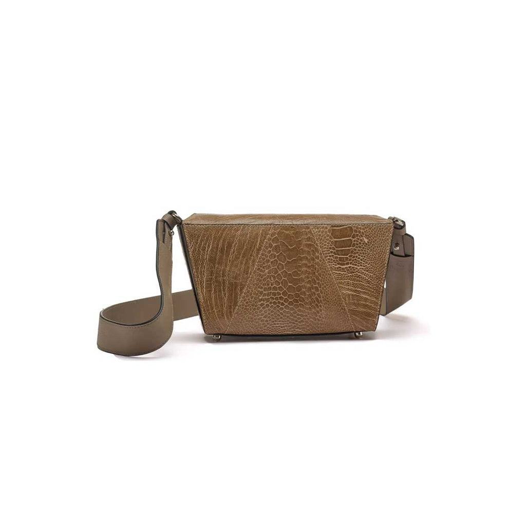 A dark asclepias handbag with a structured design, featuring an embossed logo on the strap, a magnetic closure, and protective bottom studs.