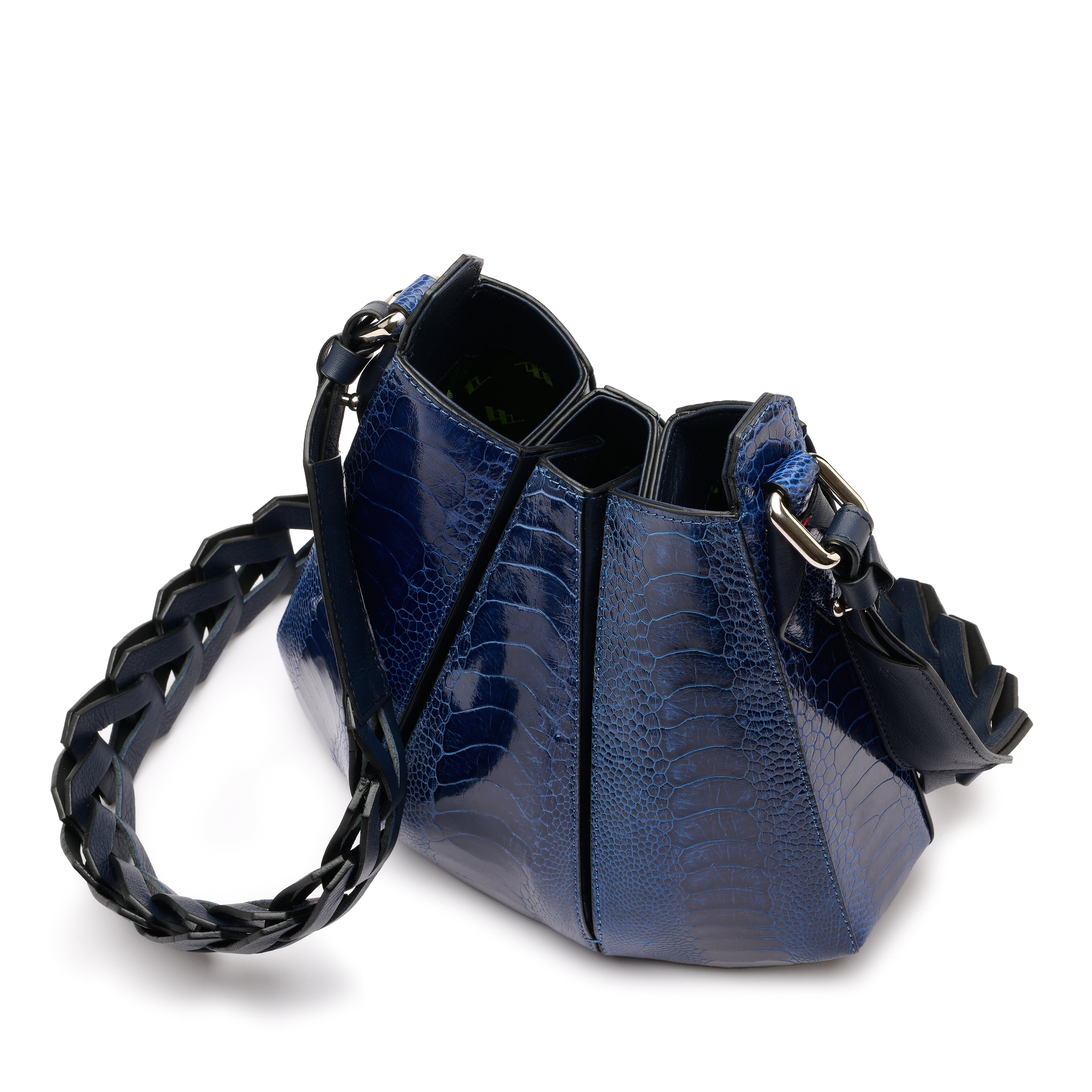 A blue crocodile-embossed leather shoulder bag with a black braided strap and gold-tone hardware, shown on a white background.