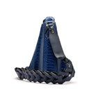 A blue crocodile-embossed leather shoulder bag with a dark navy braided leather base and strap, shown from a side angle on a white background.