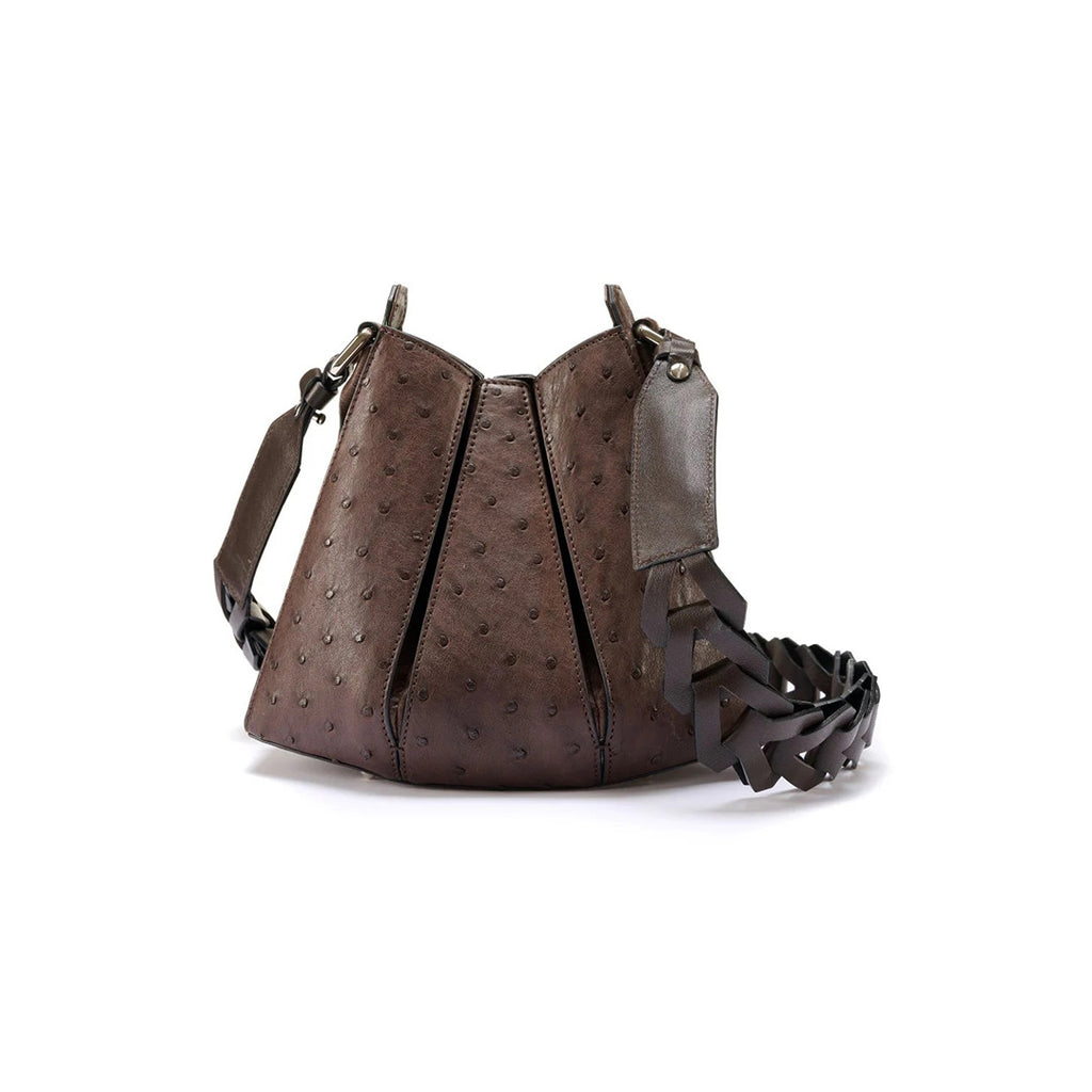 A brown, ostrich quill leather handbag with a tulip closure and a detachable strap.