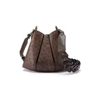A brown, ostrich quill leather handbag with a tulip closure and a detachable strap.