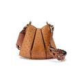 A brown, ostrich quill leather handbag with a textured pattern and a removable strap.