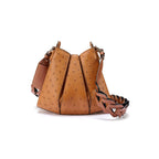 A brown, ostrich quill leather handbag with a textured pattern and a removable strap.