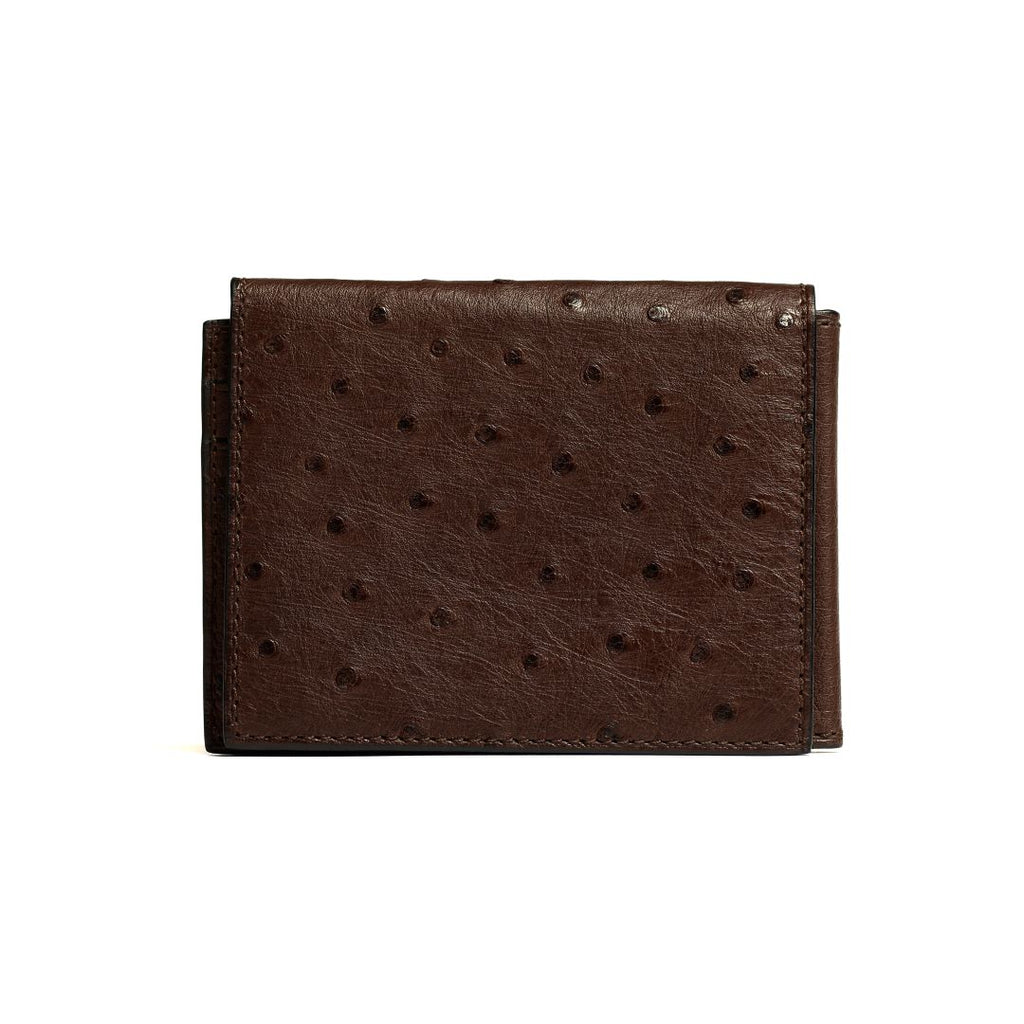 A brown, leather trifold wallet with raised dot pattern and a slip pocket.