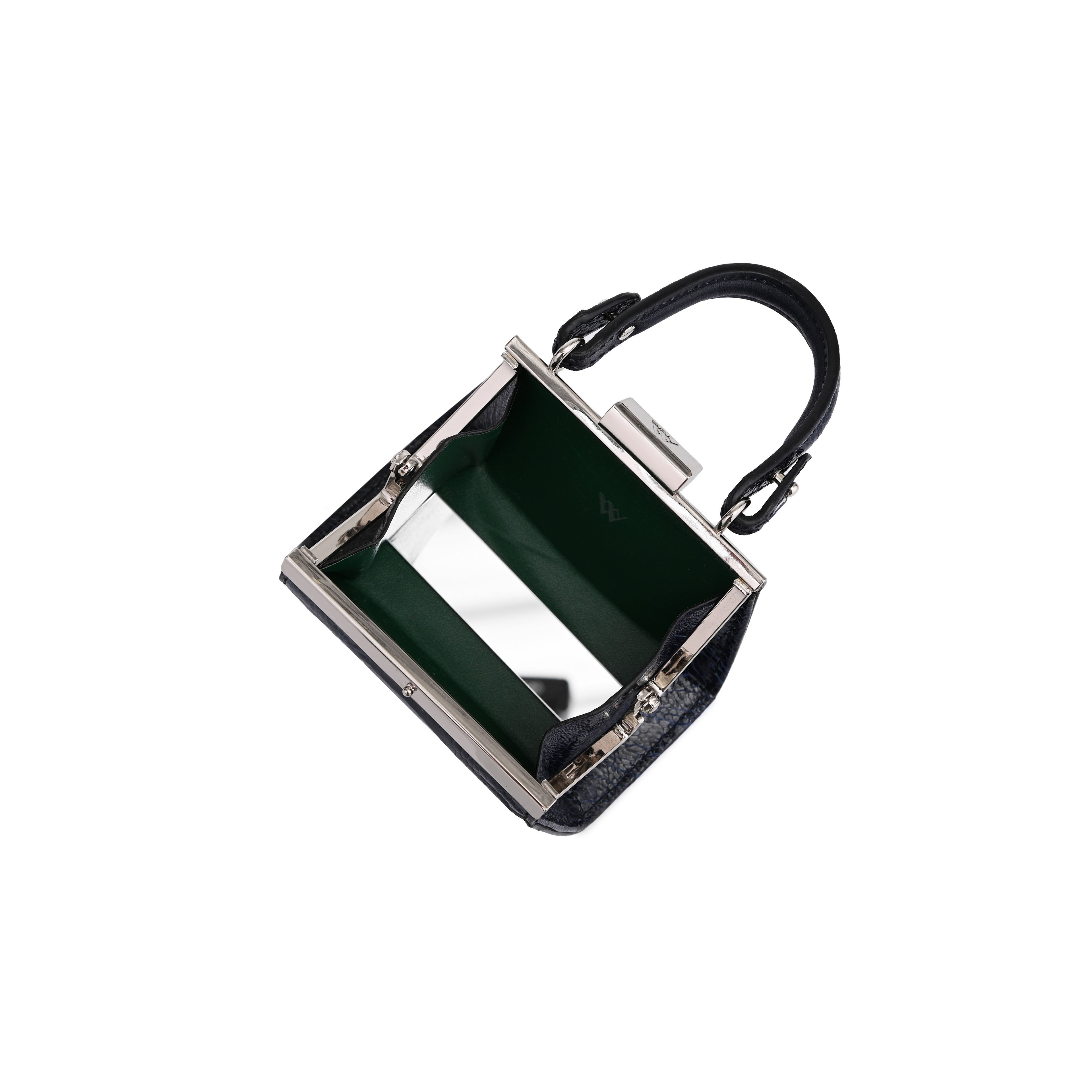 A small structured handbag with a dark green interior lining, a black top handle, and a silver-tone metal frame, shown on a plain white background.