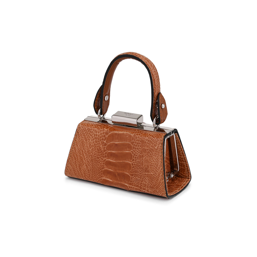A structured brown handbag with a crocodile-embossed texture, featuring a top handle, silver-tone metal hardware, and a triangular silhouette, shown on a plain white background.