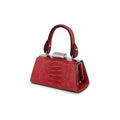 A small red textured leather handbag with a top handle, silver-tone metal frame, and black trim, shown on a plain white background.