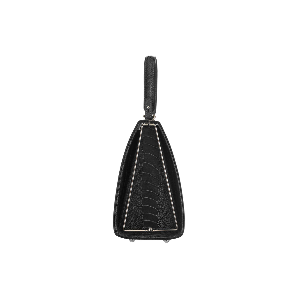 Black leather handbag with a unique design on a white background