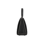 Black leather handbag with a unique design on a white background