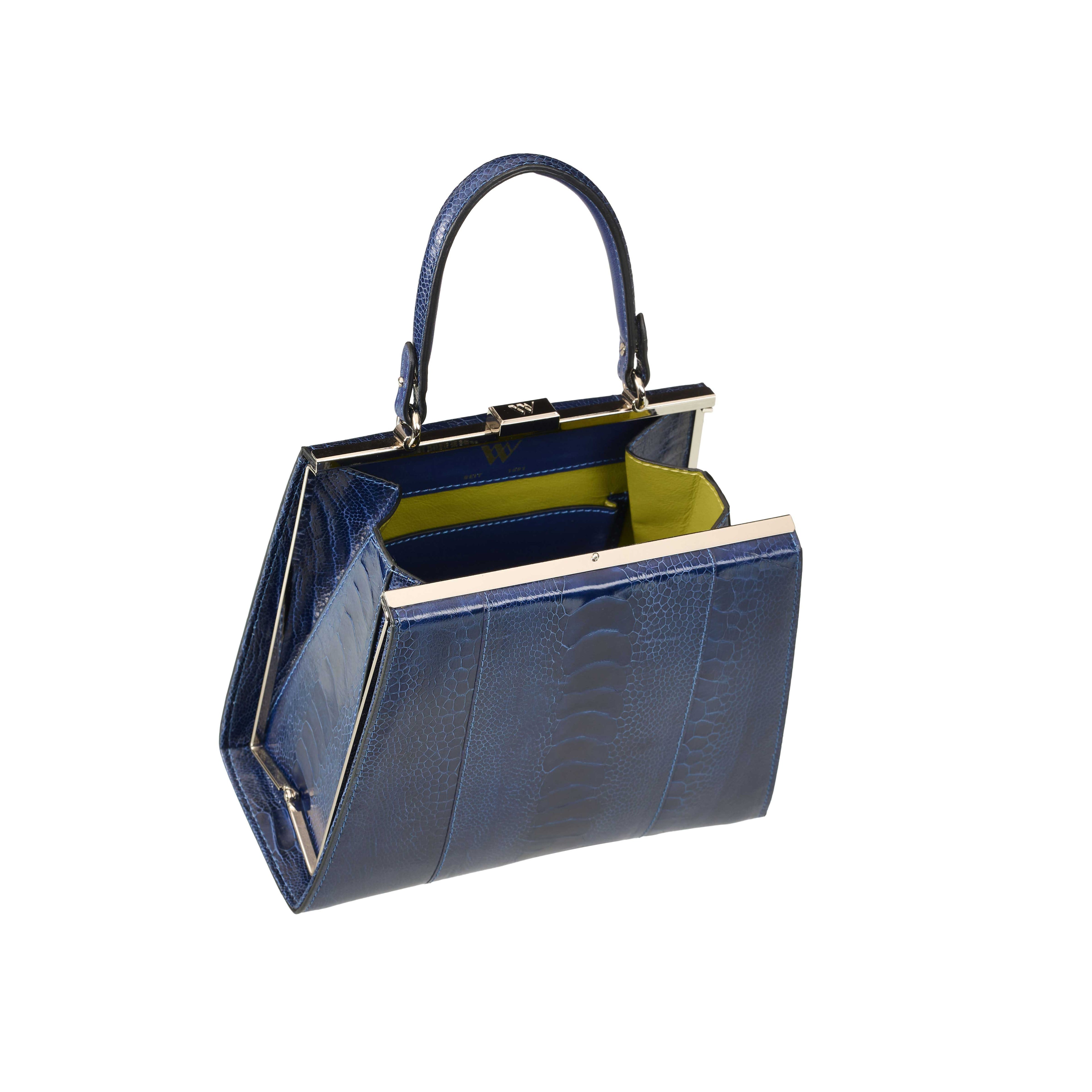 Blue handbag with a gold frame on a white background
