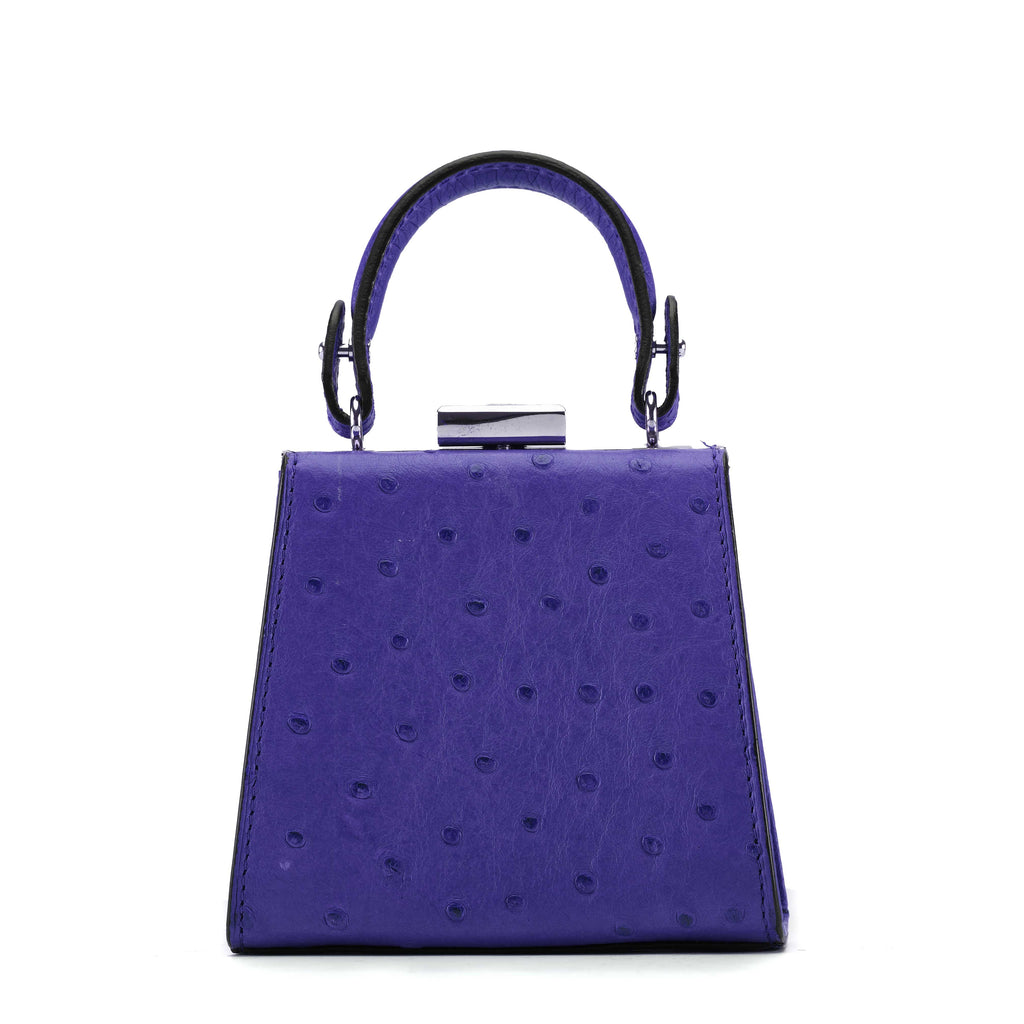 Purple handbag with a textured surface on a white background