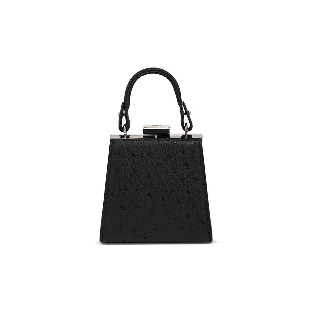 A black leather handbag with a textured pattern and a removable handle.