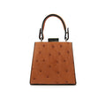 A cognac brown leather small clutch purse with a zipper top closure and a detachable handle.