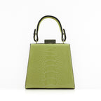 A structured lime green handbag with a crocodile-embossed texture, featuring a top handle with black trim and a silver-tone metal clasp, set against a plain white background.