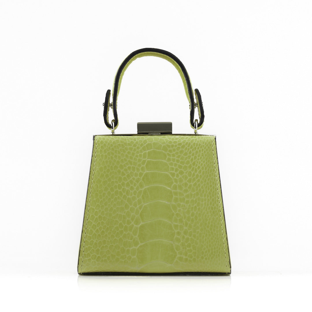 A structured lime green handbag with a crocodile-embossed texture, featuring a top handle with black trim and a silver-tone metal clasp, set against a plain white background.