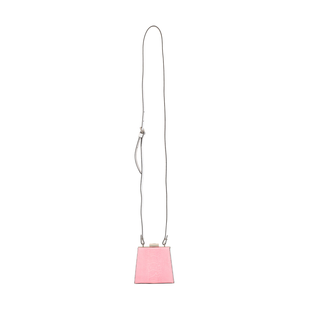Pink handbag with a long strap on a white background