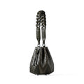Black leather handbag with braided handle on a white background