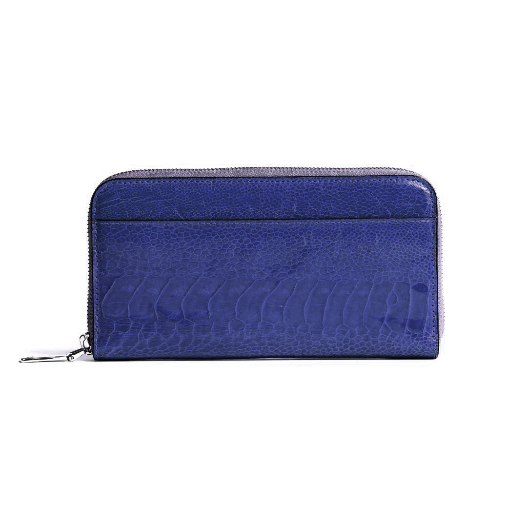 A blue zip-around wallet with a textured crocodile-embossed leather finish, shown against a plain white background.