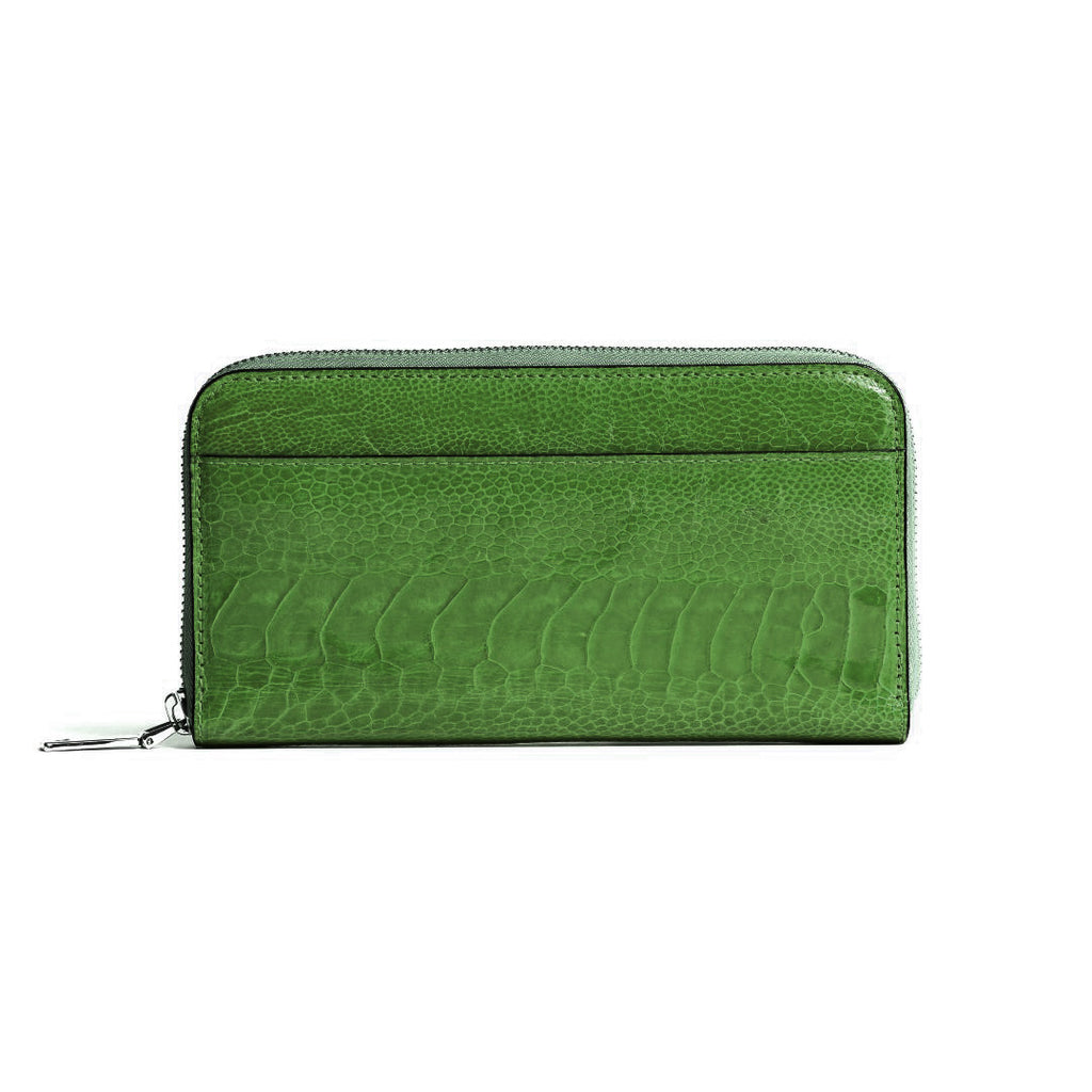 A green zip-around wallet with a textured crocodile-embossed leather finish, shown against a plain white background.
