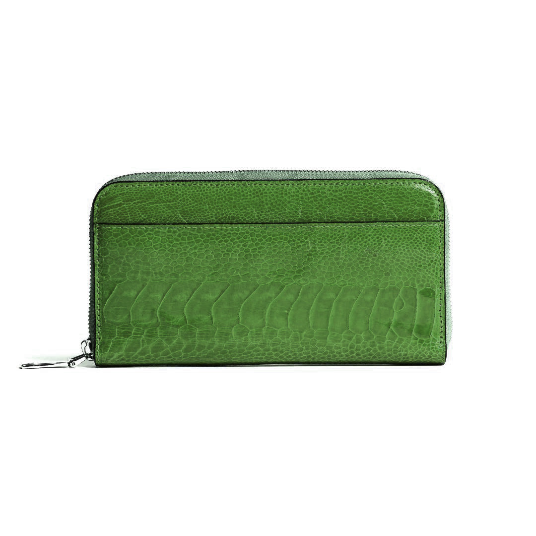 A green zip-around wallet with a textured crocodile-embossed leather finish, shown against a plain white background.