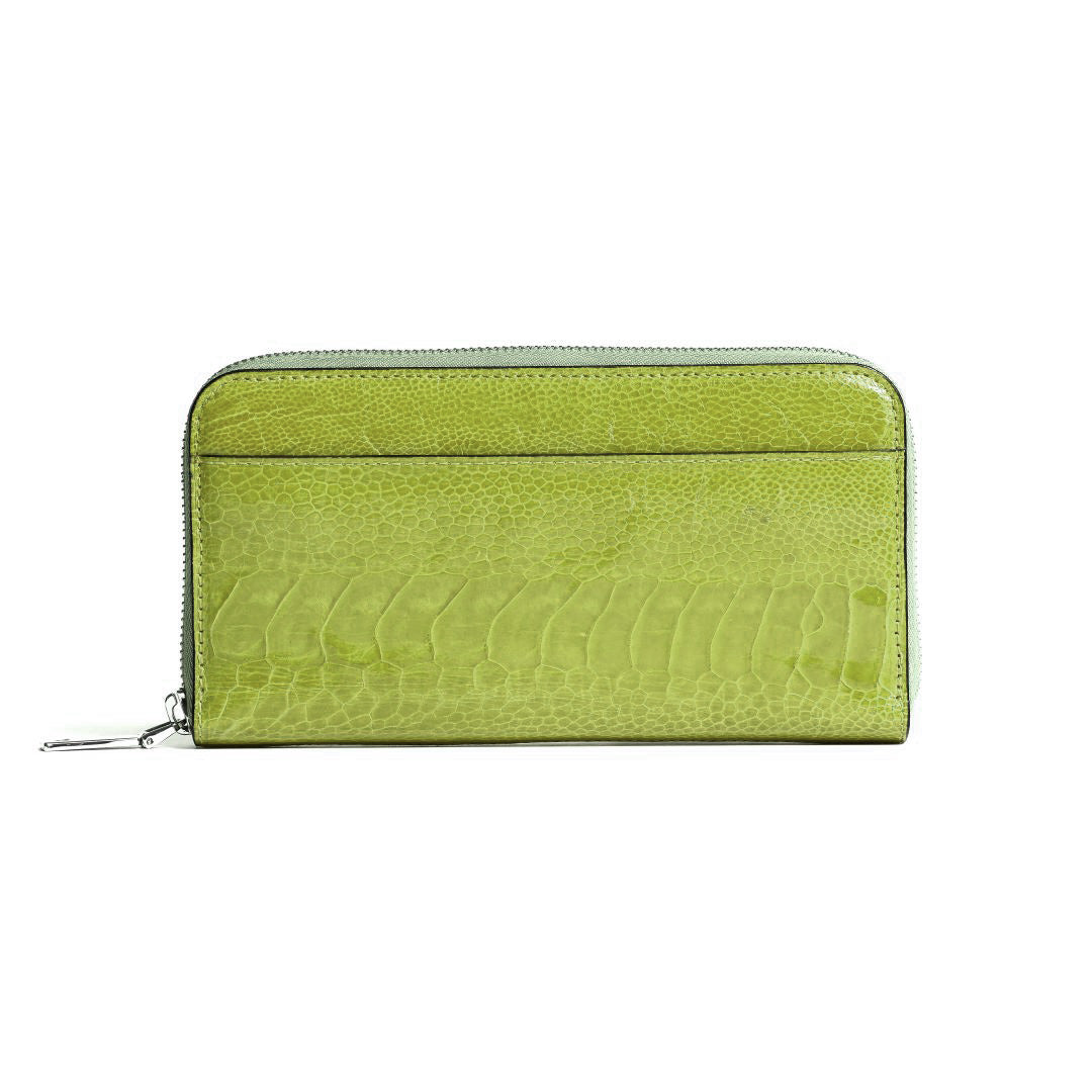 A lime green zip-around wallet with a textured crocodile-embossed leather finish, shown against a plain white background.