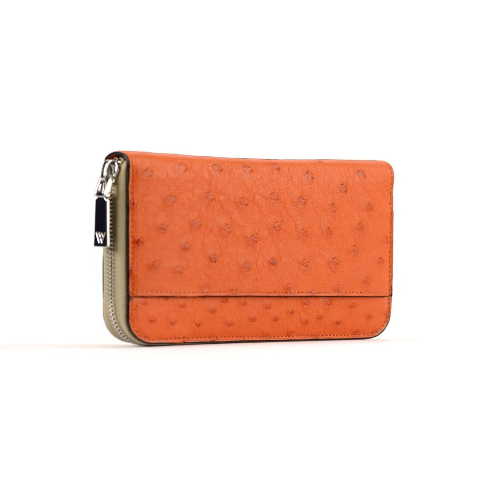 An orange wallet with a textured surface and a zipper closure, against a white background.