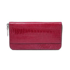 A red ostrich leather wallet with a zipper closure and several card slots visible.
